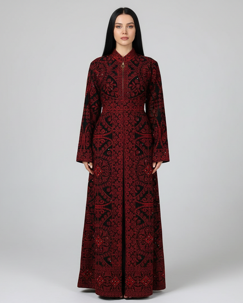 Woman wearing a long, dark red patterned dress on a white background
